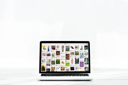KYIV, UKRAINE - JULY 23, 2019: modern laptop with pinterest website on screen on whiteのeditorial素材