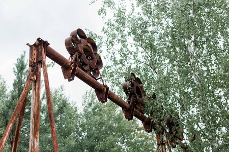 low angle view of trees near metallic construction in park