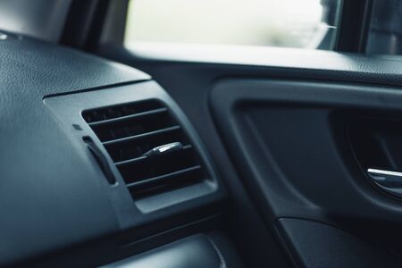 adjustable ventilation grille on dashboard of modern carの写真素材
