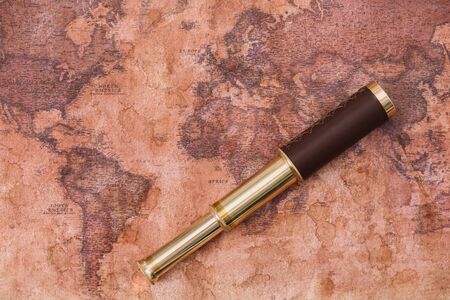 top view of telescope on ancient world map