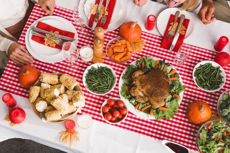 top view of family members sitting at table in Thanksgiving dayの写真素材