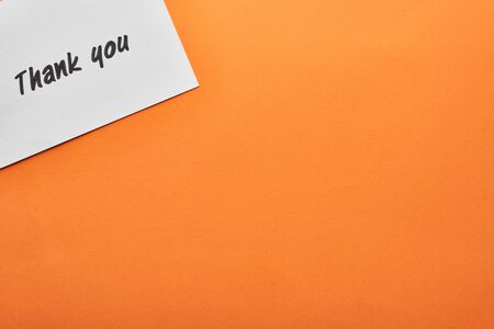 top view of thank you card on orange backgroundの写真素材