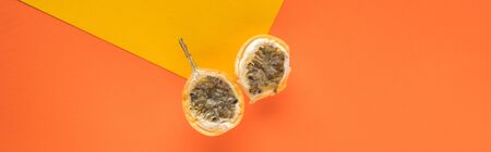 top view of sweet granadilla on yellow and orange background with copy space, panoramic shot