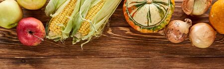 top view of autumnal vegetables served on wooden tableの写真素材