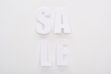 top view of white sale lettering on white backgroundの写真素材