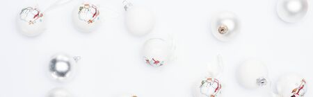 top view of silver and  white baubles on white background, panoramic shotの写真素材
