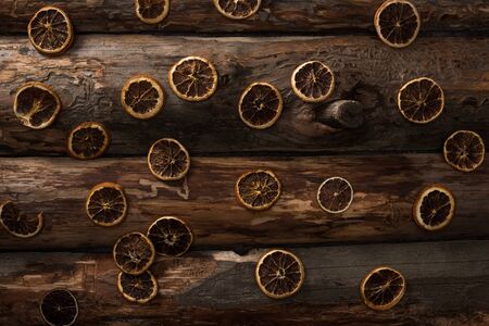 top view of dried citrus slices on wooden backgroundの写真素材