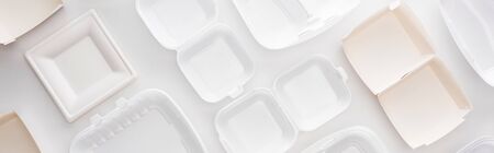 panoramic shot of empty eco packages on white background