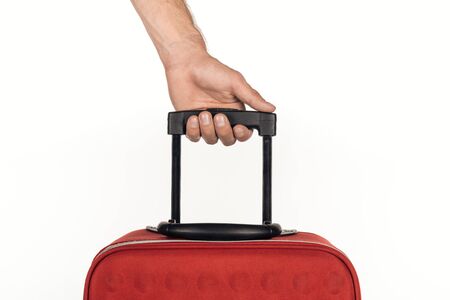 cropped view of man holding travel bag on white backgroundの写真素材