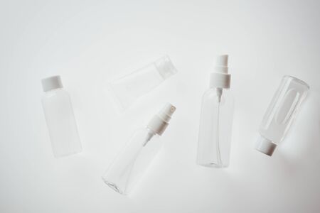 top view of white bottles with liquids ob white backgroundの写真素材