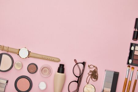 top view of decorative cosmetics isolated on pinkの写真素材