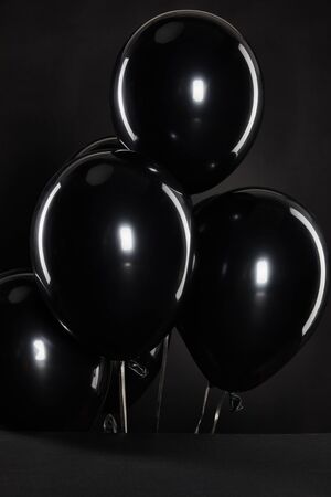 black balloons isolated on black, black Friday conceptの写真素材