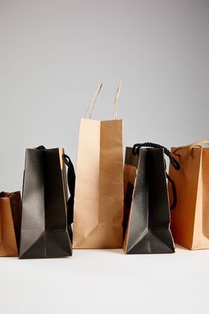 paper shopping bags isolated on grey, black Friday conceptの写真素材