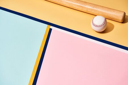 Baseball bat and ball on colorful background with lines