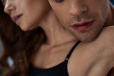 cropped view of man near young woman at homeの写真素材