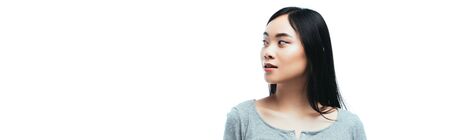 panoramic shot of asian girl looking away isolated on white