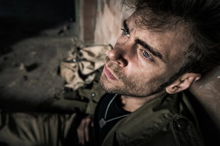 selective focus of handsome man suffering pain, post apocalyptic concept