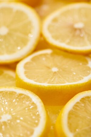 close up view of ripe fresh yellow lemon slices