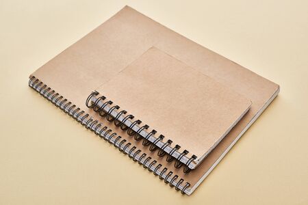 two paper blank notebooks on beige backgroundの写真素材