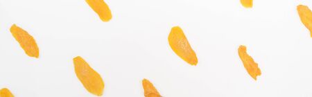 top view of dried mango slices isolated on white, panoramic shotの写真素材