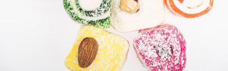 top view of assorted delicious turkish delight in coconut flakes isolated on white, panoramic shotの写真素材