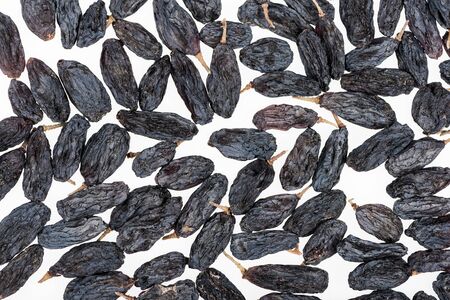 top view of black raisins isolated on white