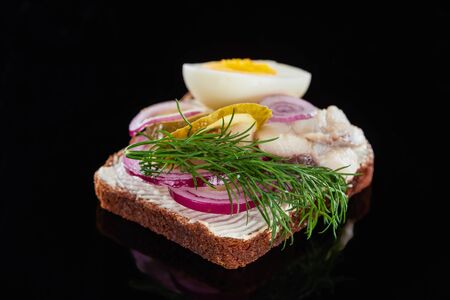 selective focus of dill on delicious danish smorrebrod sandwich on blackの写真素材