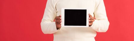 panoramic shot of man holding digital tablet with blank screenの写真素材
