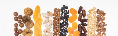 top view of assorted turkish dried fruits and nuts isolated on white, panoramic shotの写真素材