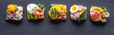 panoramic shot of delicious danish smorrebrod sandwiches on greyの写真素材