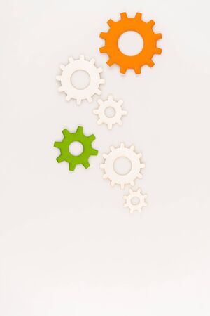 top view of colorful gears isolated on whiteの写真素材