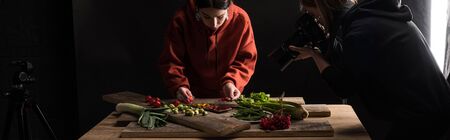 professional photographers making food composition for commercial photography and taking photo on digital camera , panoramic shotの写真素材