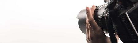 cropped view of female photographer working with digital camera isolated on white, panoramic shot