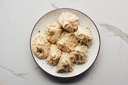 top view of delicious khinkali on marble tableの写真素材