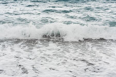 waves splash on sea shore in summerの写真素材
