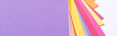 panoramic shot of bright and colorful papers isolated on white