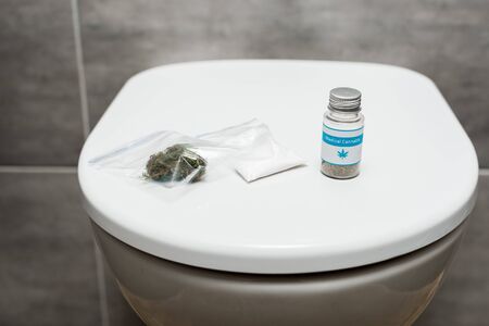 marijuana buds, cocaine and medical cannabis on toilet bowlの写真素材