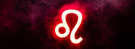 red illuminated Leo zodiac sign with smoke on background, panoramic shotの写真素材