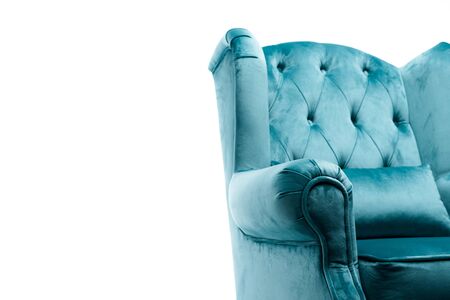 close up view of elegant velour blue armchair with pillow isolated on whiteの写真素材