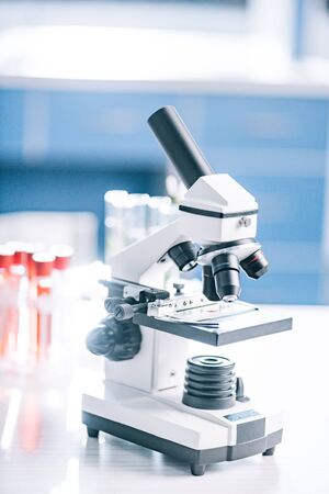 selective focus of microscope near test tubes with samples 