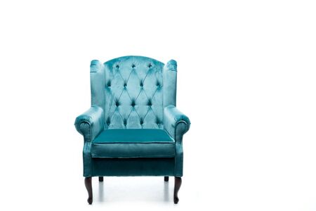 elegant velour blue armchair with pillow isolated on whiteの写真素材