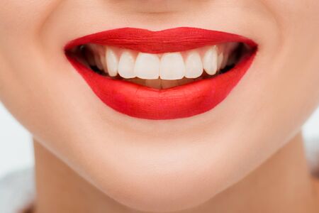 cropped view of happy young woman with red lipstickの写真素材