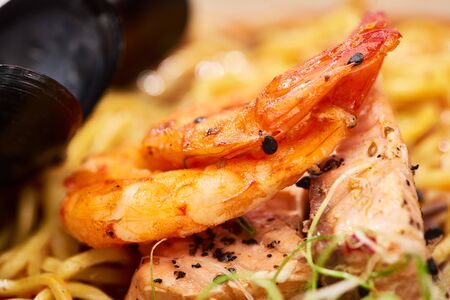 close up view of spicy ramen with shrimps and chickenの写真素材