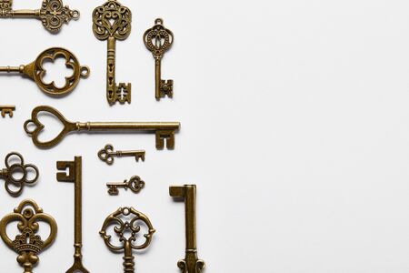 top view of retro keys on white background with copy space