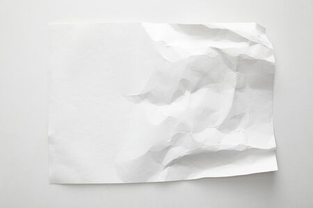 top view of empty crumpled paper on white background