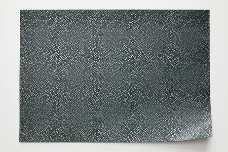 top view of empty dotted grey paper on white background