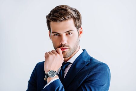 handsome businessman in blue suit isolated on whiteの写真素材