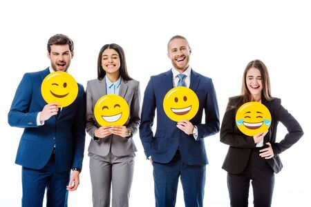 multicultural business people in suits holding smileys isolated on whiteの写真素材