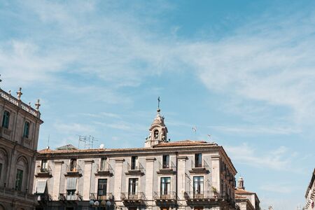 CATANIA, ITALY - OCTOBER 3, 2019: clock tower of Saint Agatha cathedral near old buildingsのeditorial素材