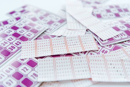 selective focus of purple lottery paper ticketsの写真素材